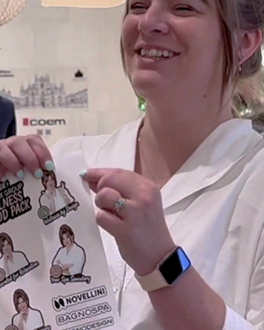 Guest holding personalised peel-off stickers created live at an AI Sticker Photo Booth event